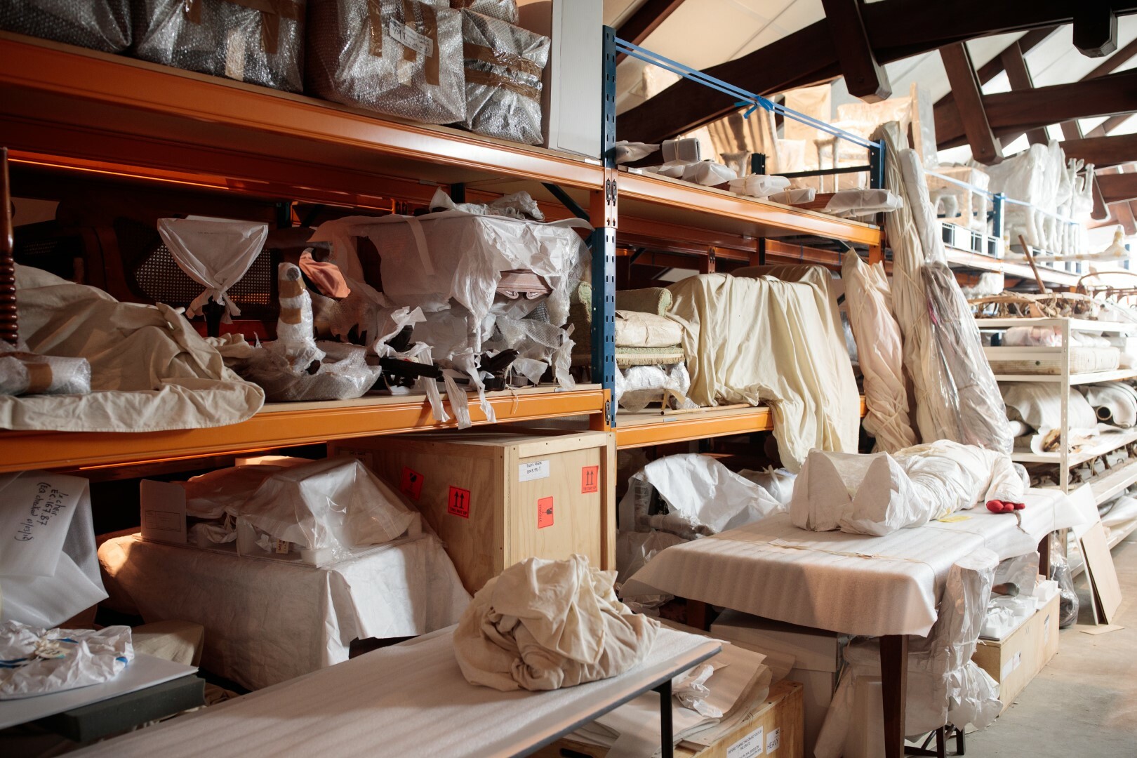 Museum artefacts wrapped in white sheets